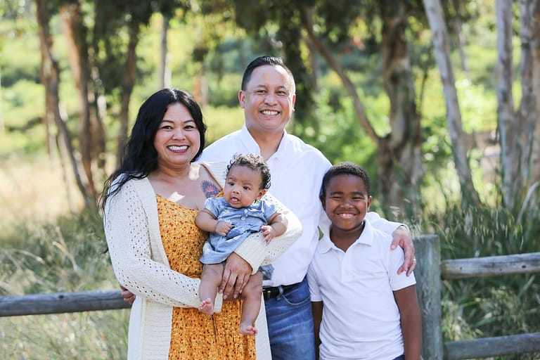 Diverse modern family mixed race parents grandparents grandchildren grandkids portrait.
