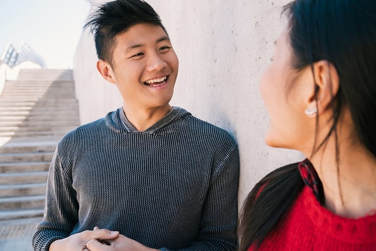 Asian couple having a conversation.