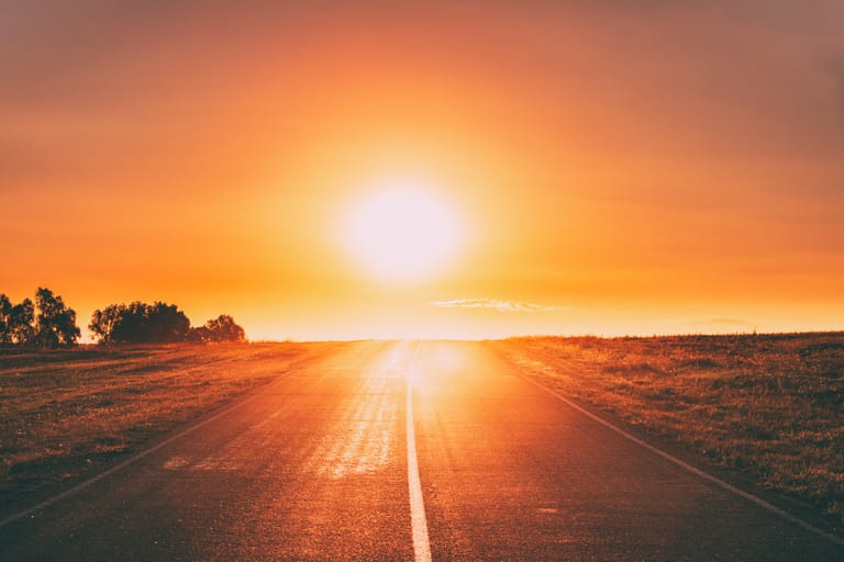 Sun Rising Above Asphalt Country Open Road In Sunny Sunrise Morn