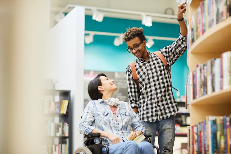 Helping disabled student girl